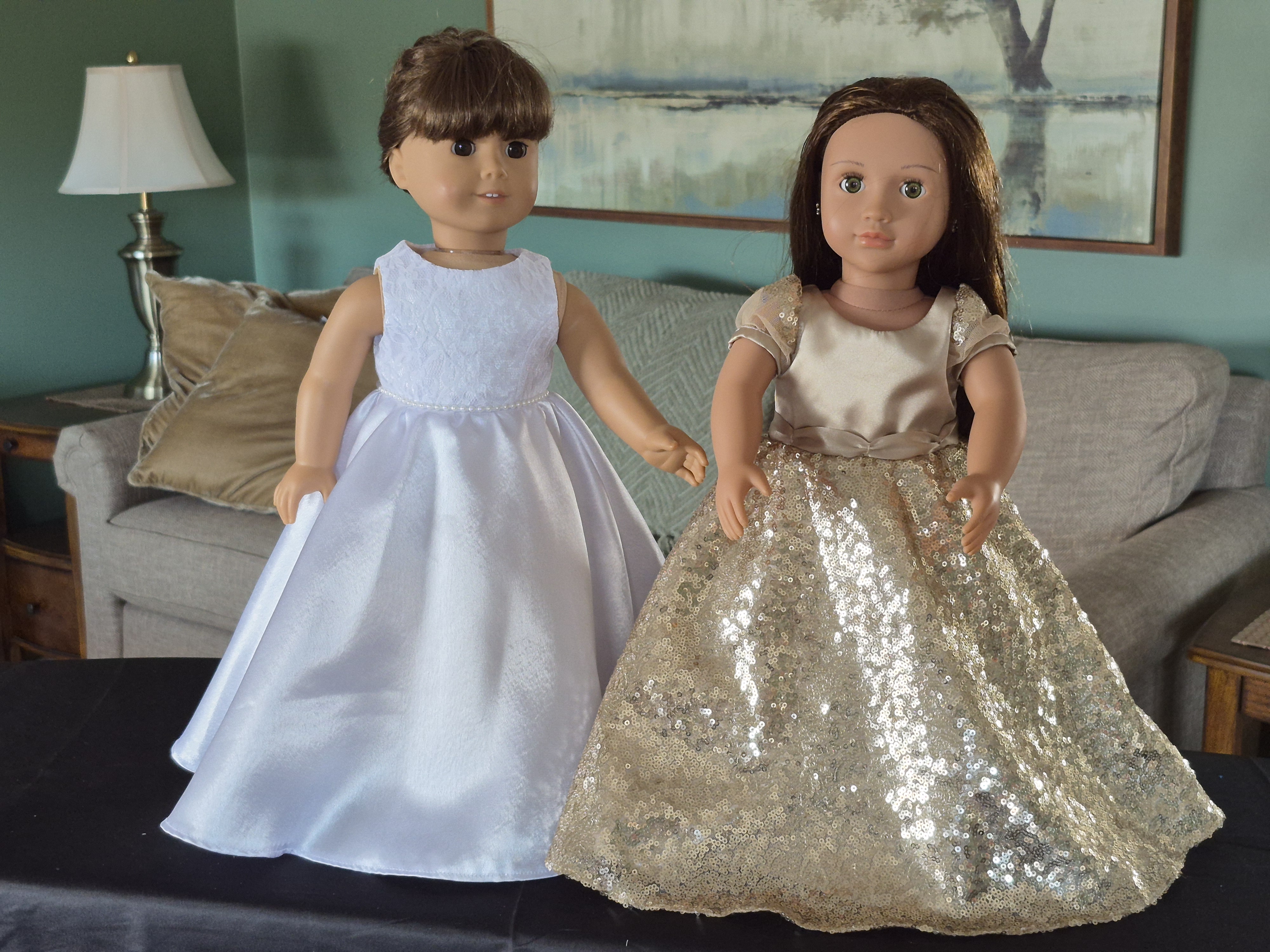 image with two dolls in dresses