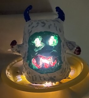 Image of a lit yeti luminary