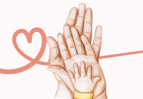 A family hands placed together, with the child's hand on top