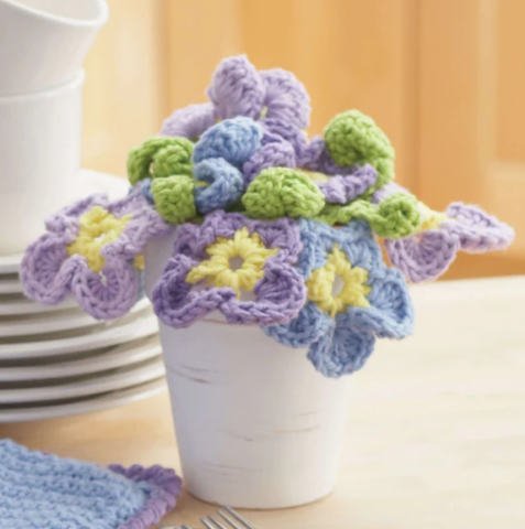 Boquet of crochet panseys in purple and blue.