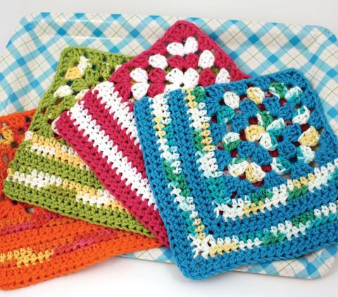 Brightly colored crochet dishcloth, with a granny square corner.