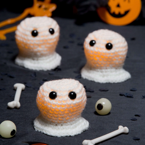 Crochet ghost over electric tealight