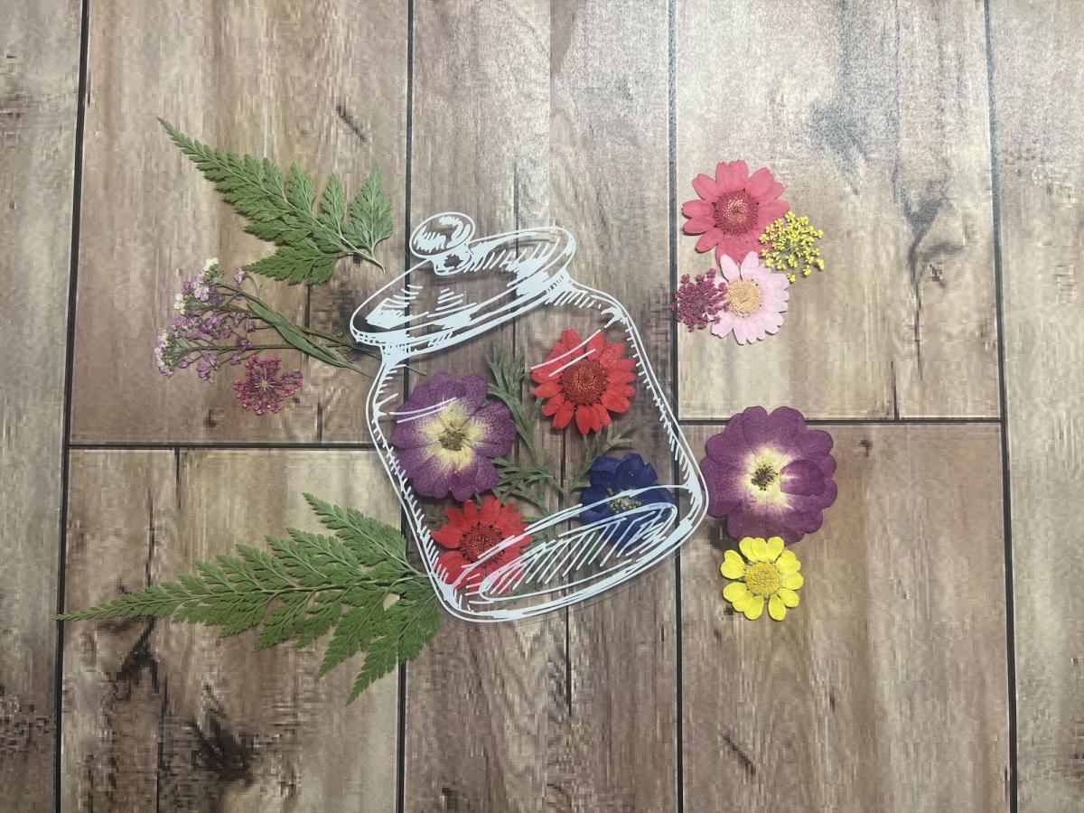 Dried flowers inside a clear jar 